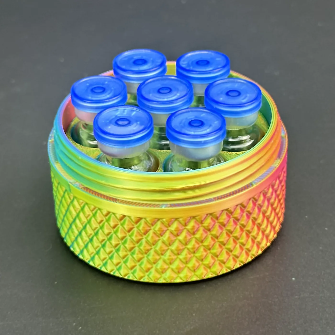 cylindrical vial case loaded with seven 3ml glass vials